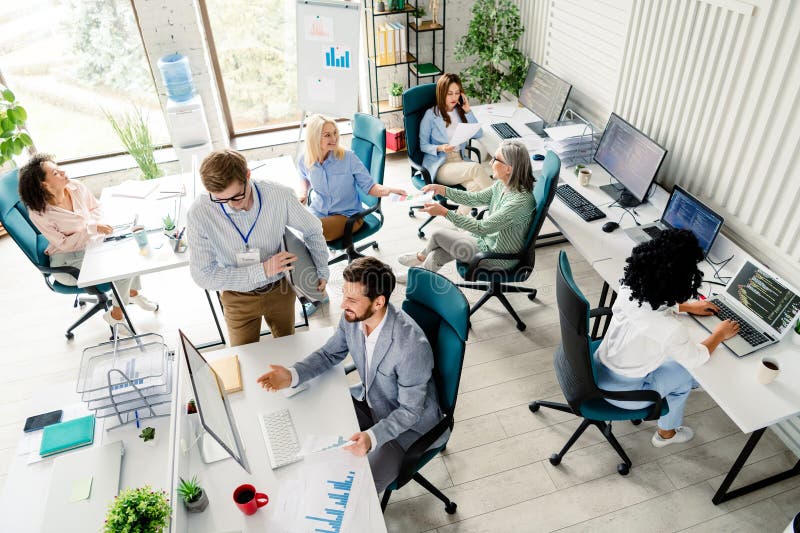 Diverse team of professionals collaborating in a modern open-plan office
