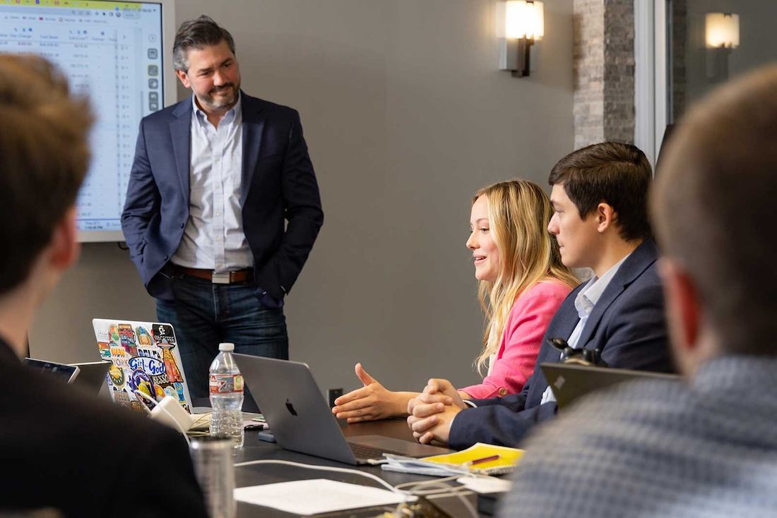 Professional financial advisor consulting with a client in a modern European office